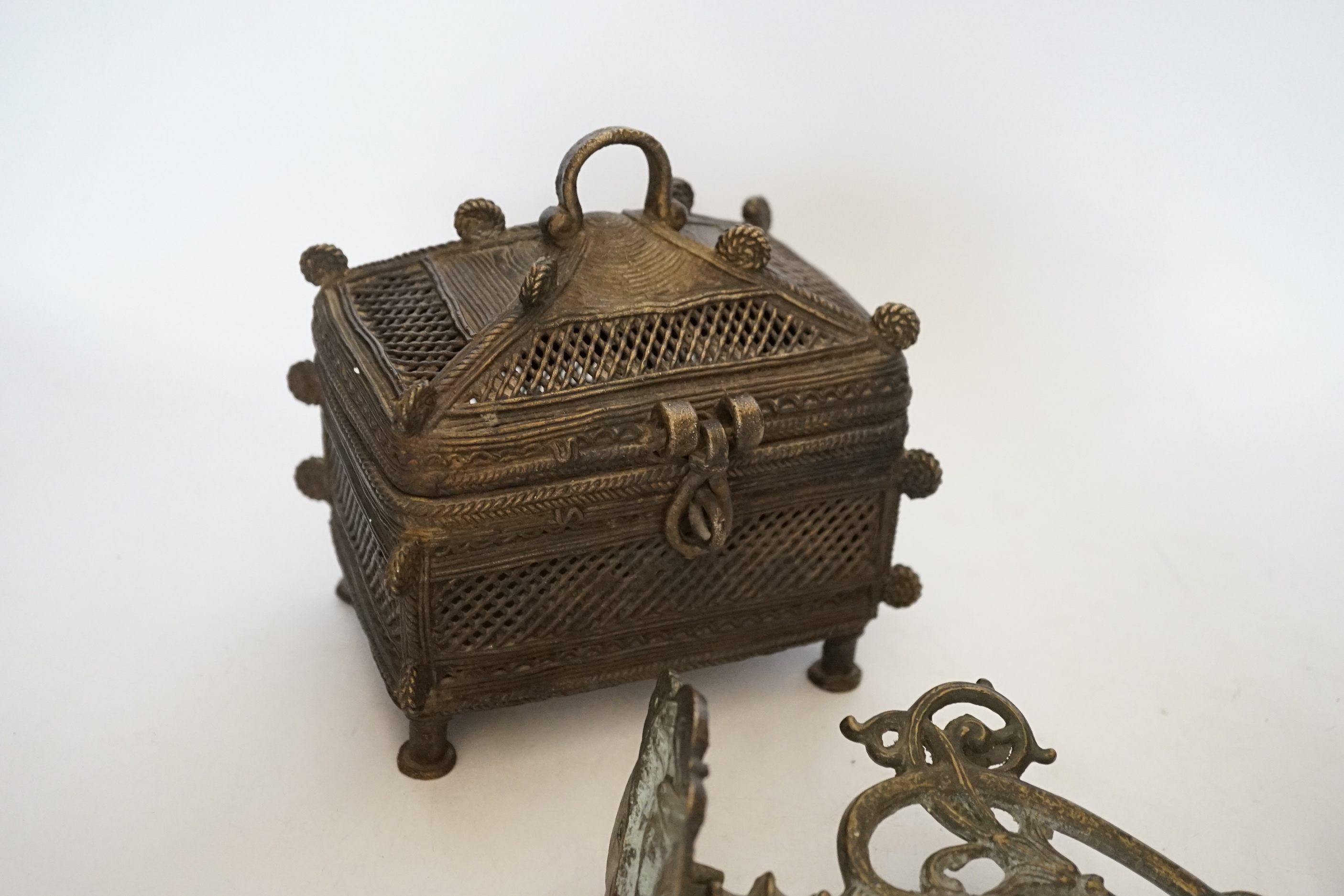 An African Benin style bronze casket and pair of wall sconces, 22cm